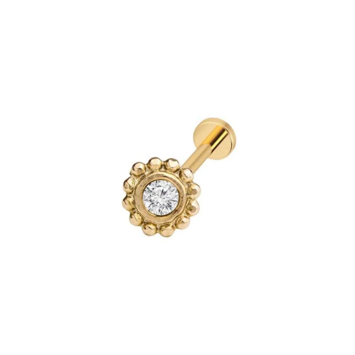 A gold-colored nose ring with a diamond-encrusted center.