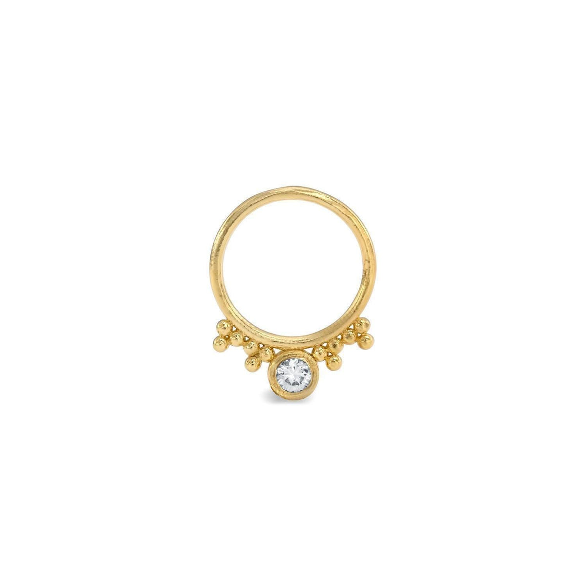 A gold ring with a large central gemstone, possibly a diamond, surrounded by smaller gemstones or stones.