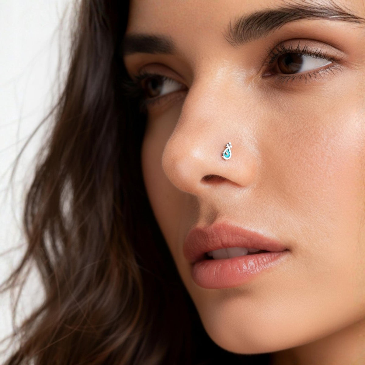A close-up of a woman's face, focusing on her nose and lips.