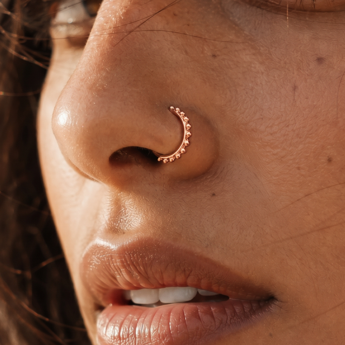 A close-up of a person's face, focusing on their nose and mouth area.