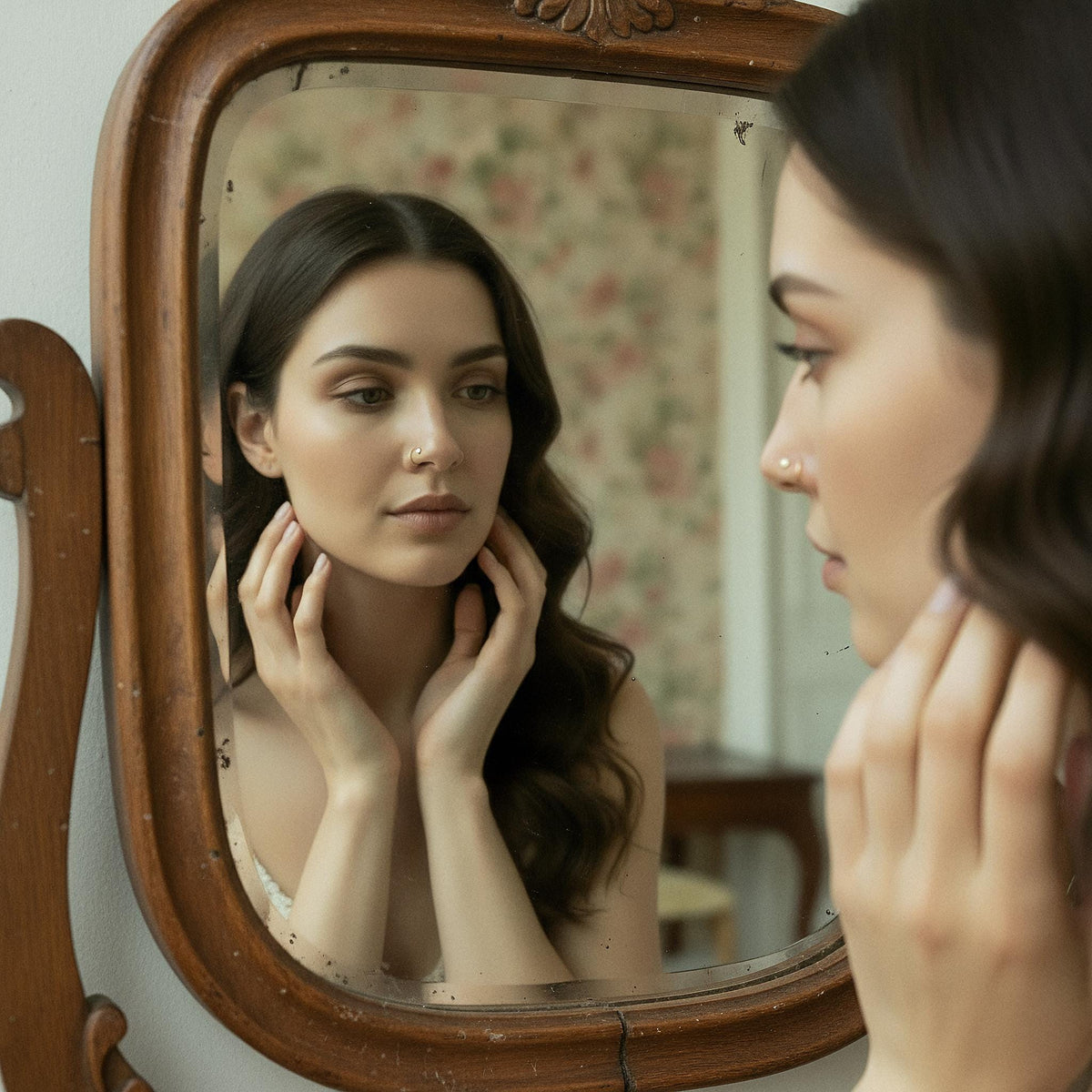 Rose Gold Nose Jewelry Set: A woman with long dark hair is seen in a mirror, her reflection captured in the ornate wooden frame.