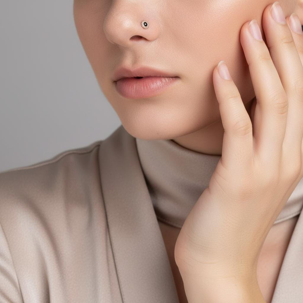 A close-up of a woman's face, focusing on her nose and hand.