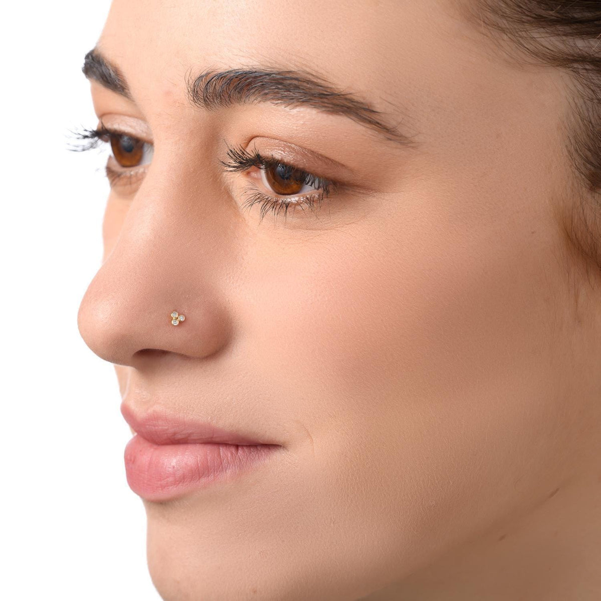 A close-up of a woman's face, focusing on her nose and lips.