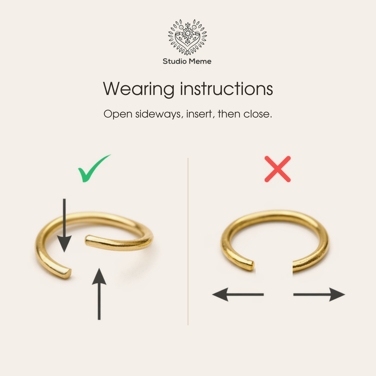 a pair of gold rings with arrows pointing in different directions
