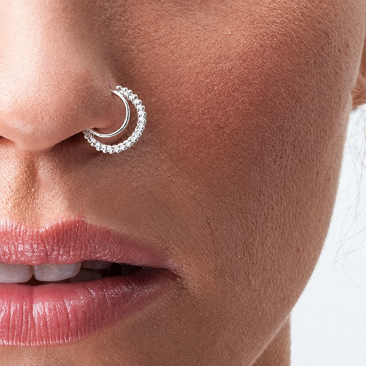 A close-up of a person's face, focusing on their nose and lips.
