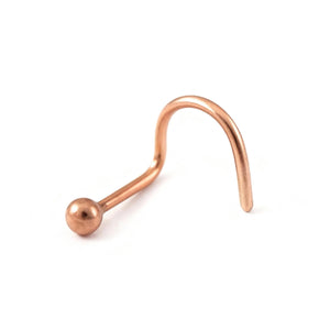 A copper-colored metal nose ring with a round ball at the end.