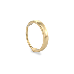 A gold ring with a curved band is shown against a white background.