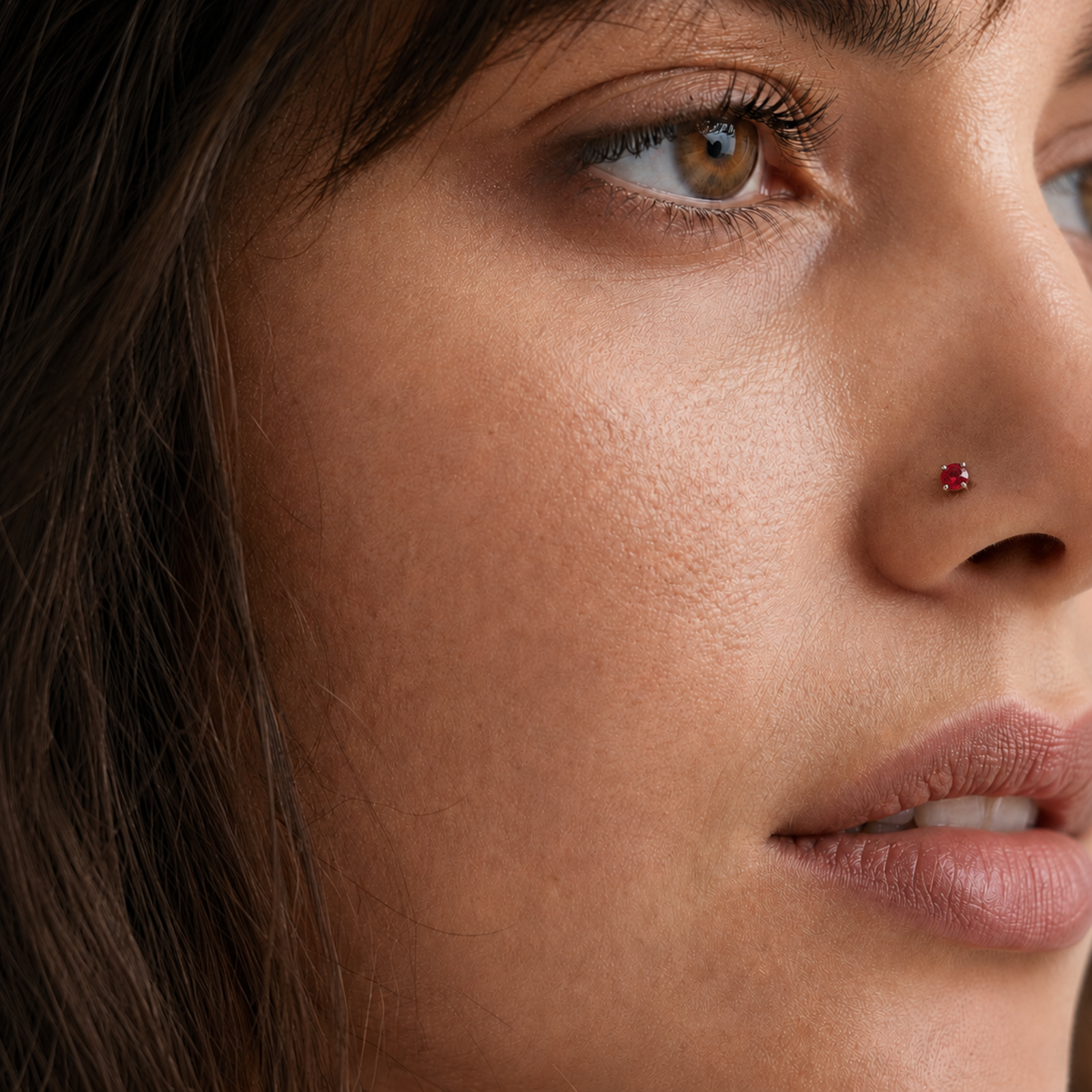A close-up of a woman's face, focusing on her nose and facial features.