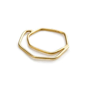 A gold-colored ring with a hexagonal shape.