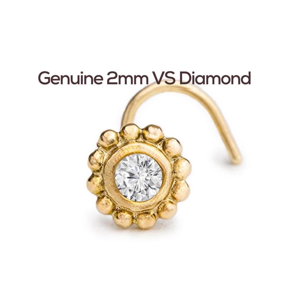 Diamond Nose Stud: a gold-colored nose ring with a large, clear diamond set in the center, accompanied by the text "Genuine 2mm VS Diamond".