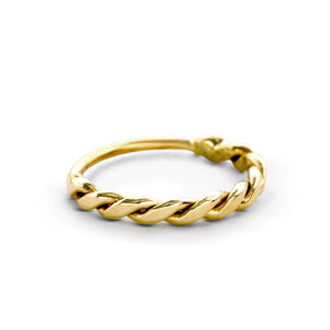 A gold ring with a twisted design.