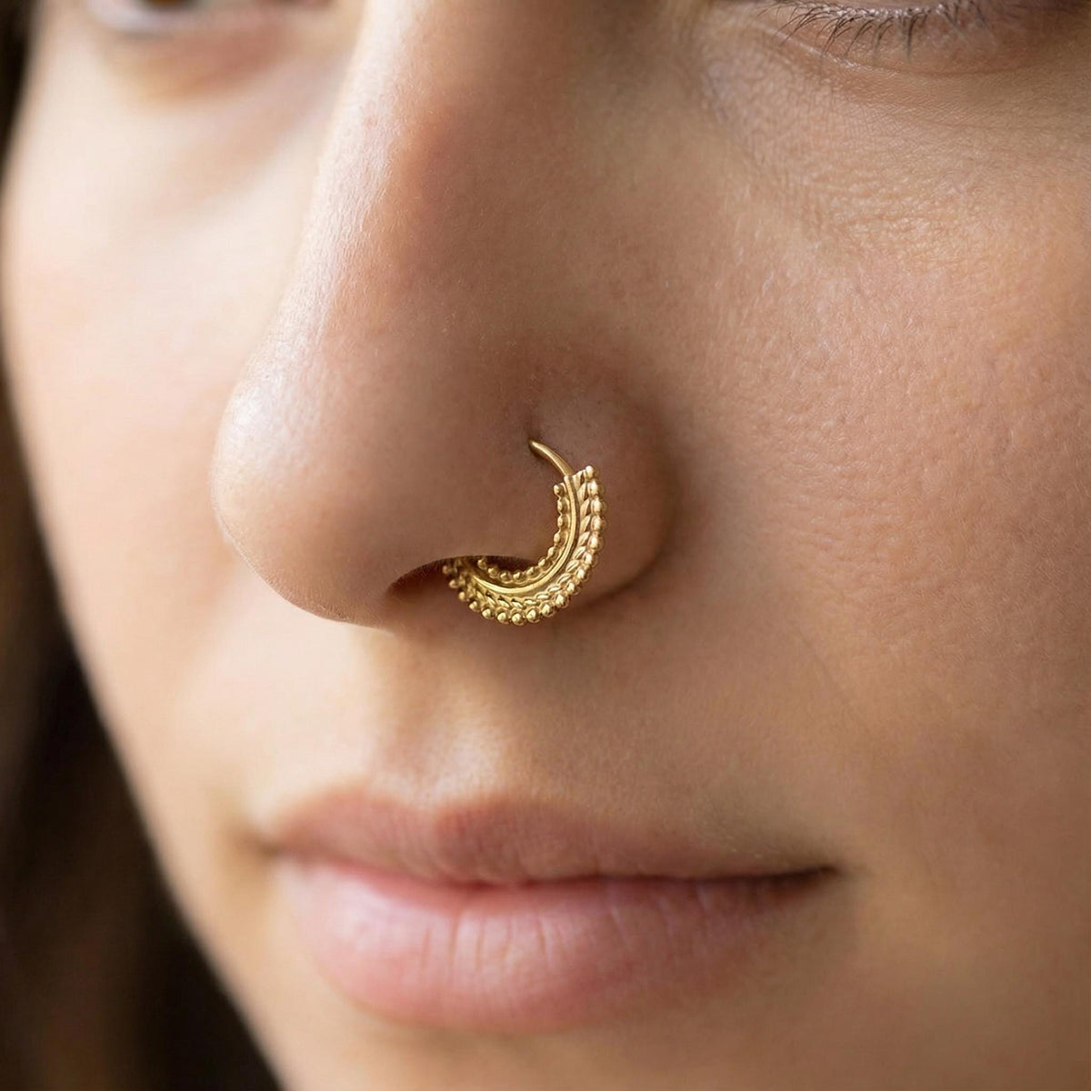 A close-up of a person's face, focusing on their nose and mouth area.
