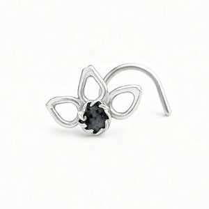A silver nose ring with a black gemstone in the center.