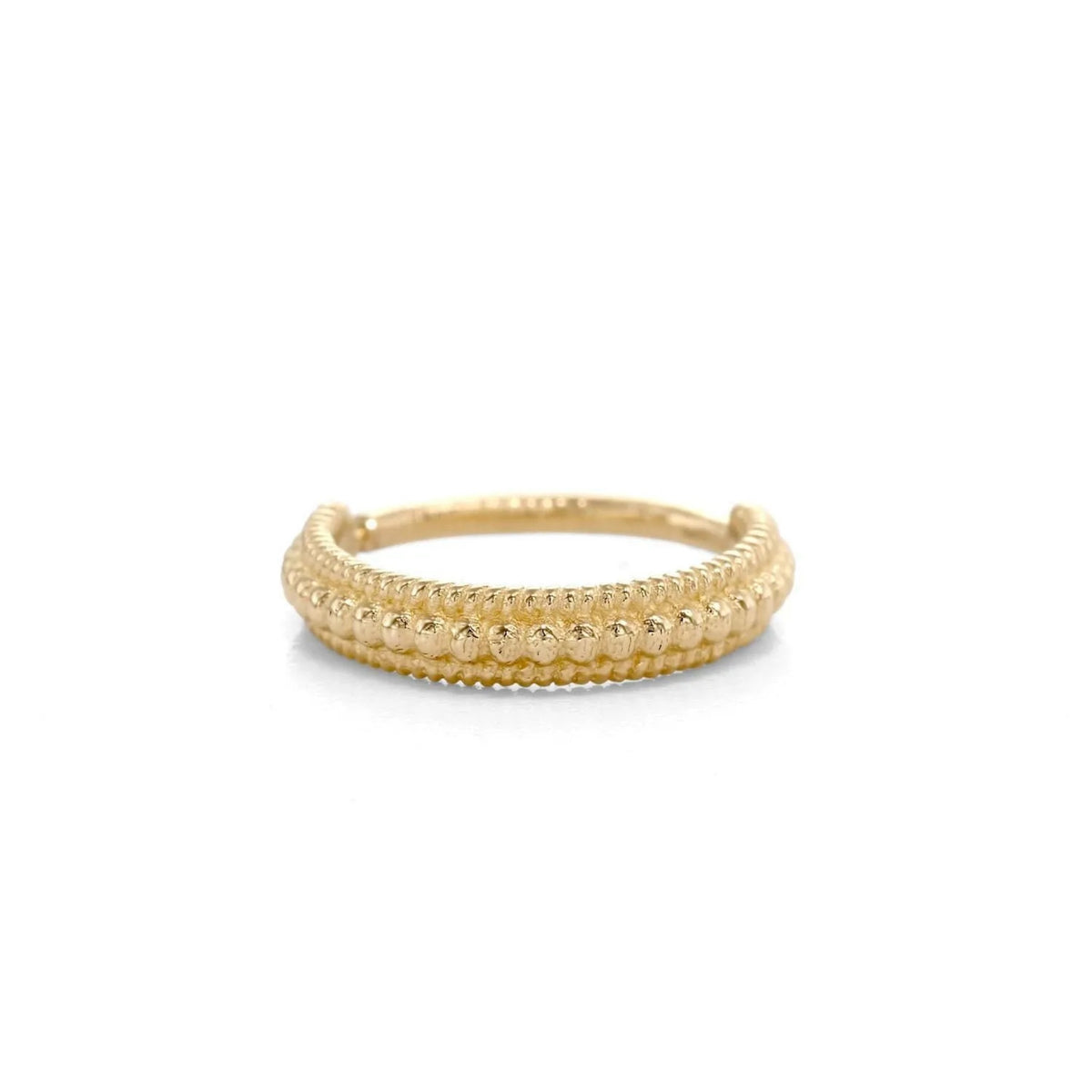 A gold ring with a textured band design.