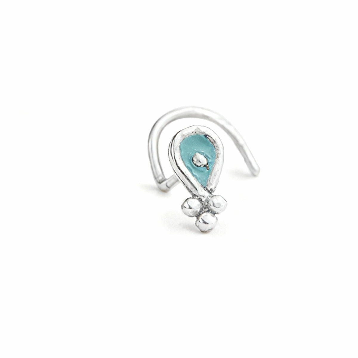 A silver nose ring with a blue gemstone in the center.