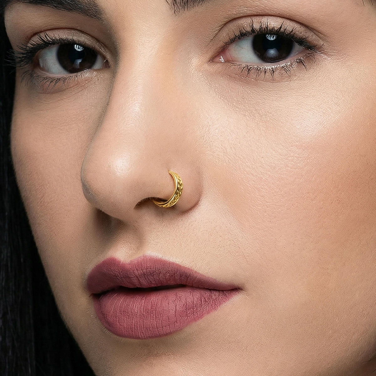 A close-up of a woman's face, focusing on her nose and lips.