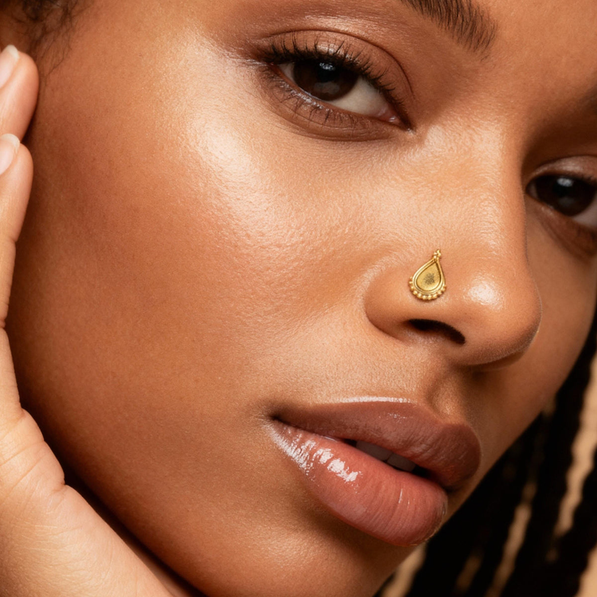Large Indian Nose Stud: A close-up of a woman's face, focusing on her nose and lips.