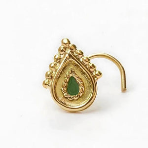 Nose Stud Jewelry: A gold-colored nose ring with a green gemstone in the center.