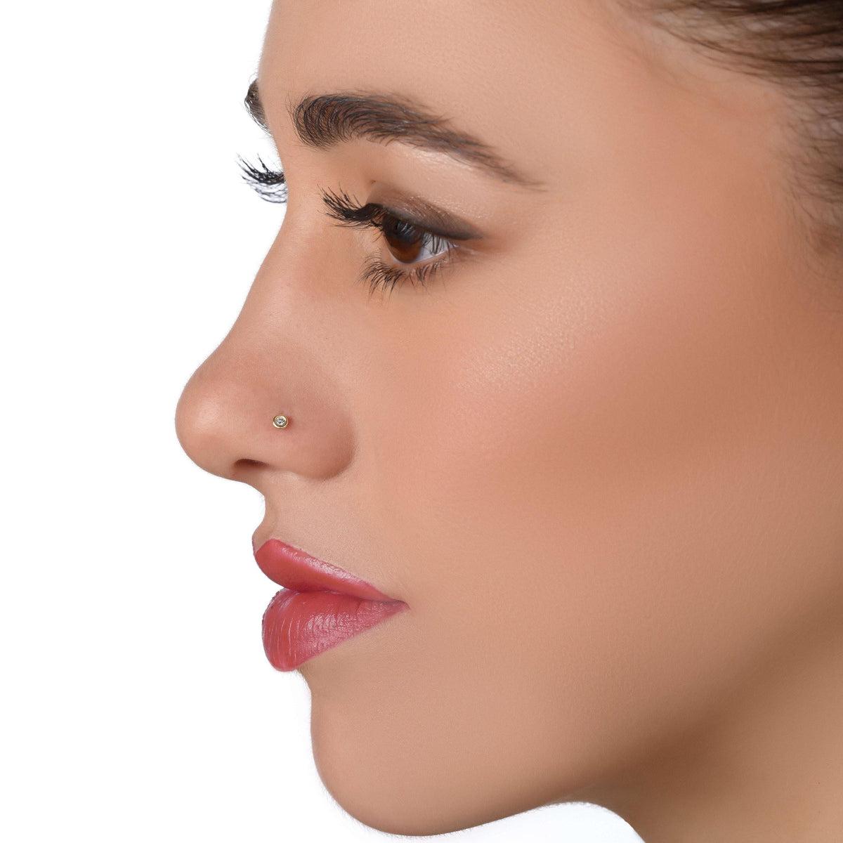 A close-up profile view of a woman's face, focusing on her nose and lips.