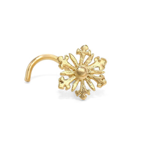 A gold-colored metal nose ring with an intricate, snowflake-like design.