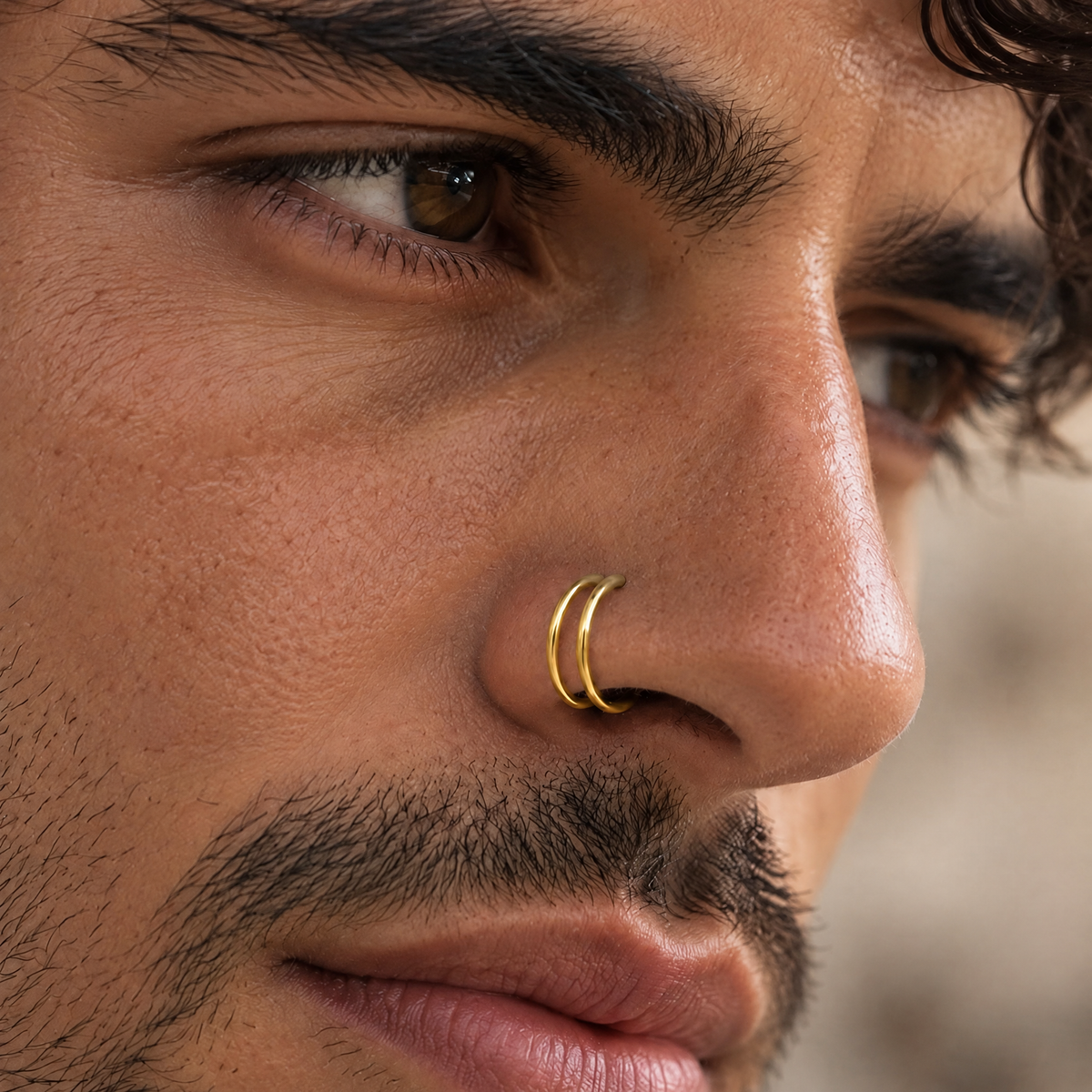 A close-up of a man's face, focusing on his nose and facial features.