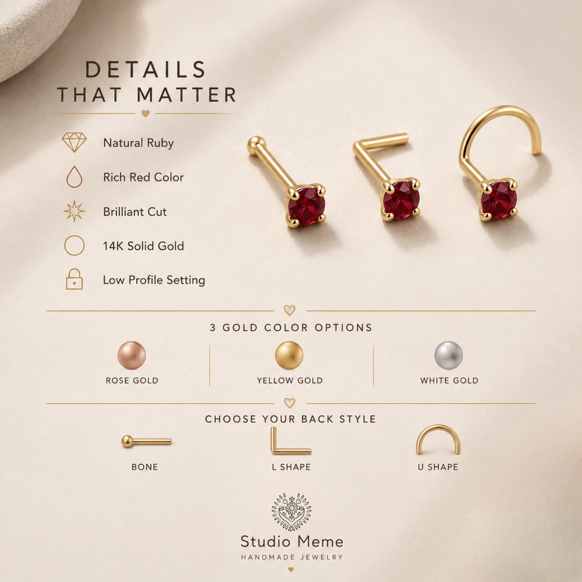 a pair of gold earrings with red stones