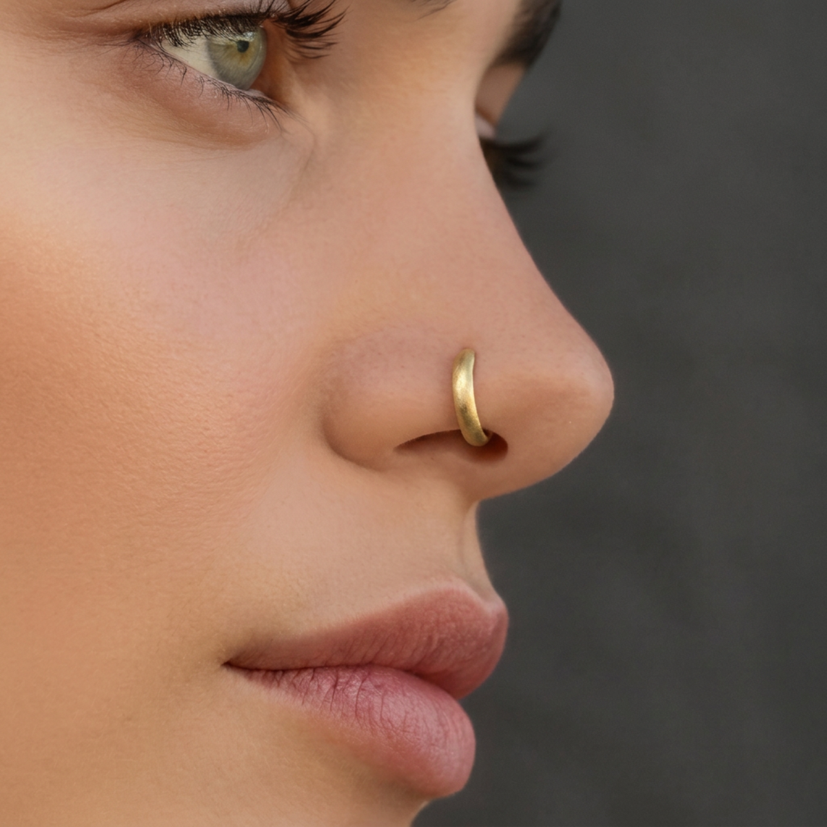 A close-up of a woman's face, focusing on her nose and lips.
