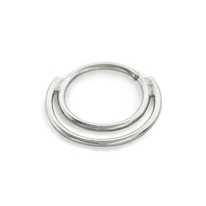A silver-colored metal ring with a circular shape and two curved ends.