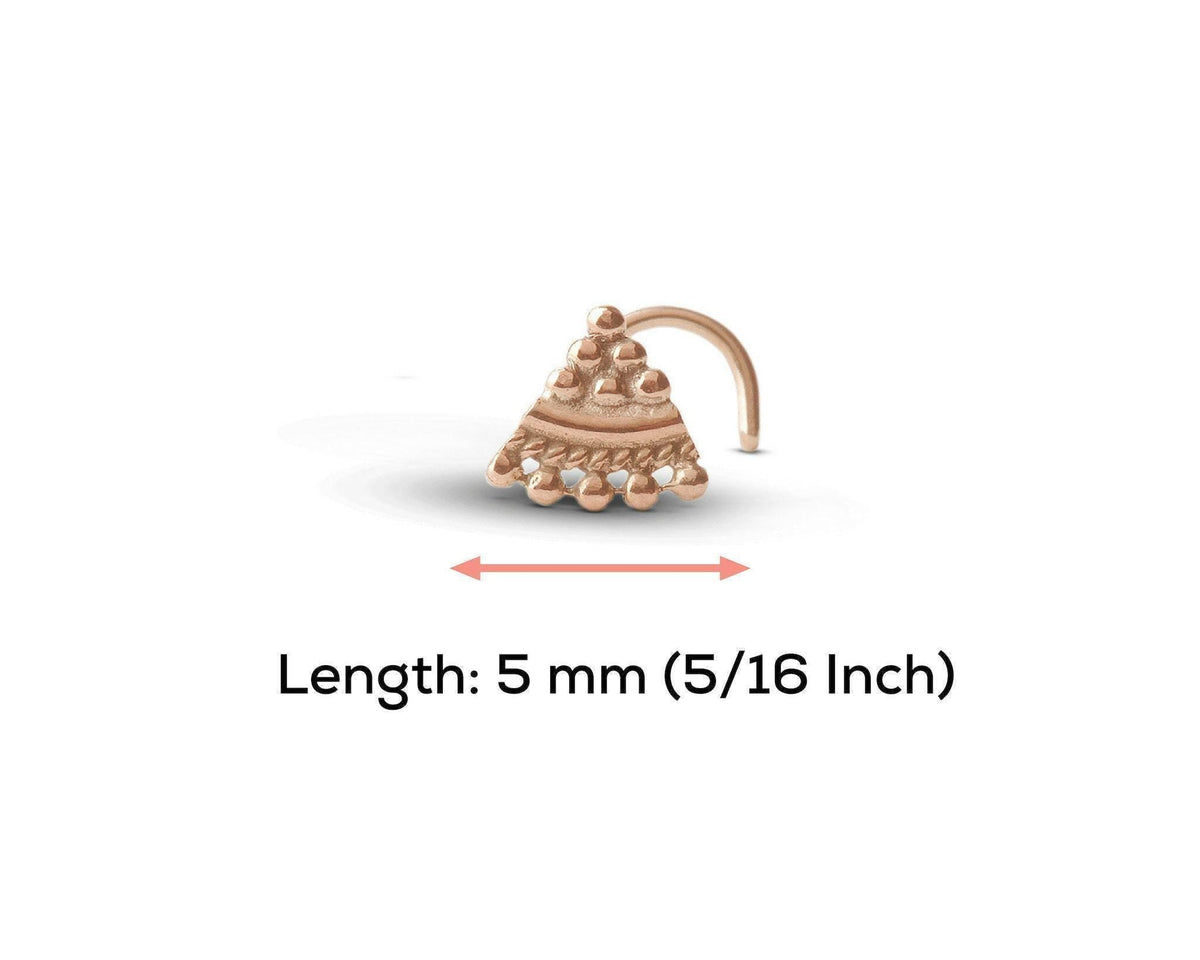 A gold-colored nose stud with a decorative design, indicating its length as 5 millimeters (5/16 inch).