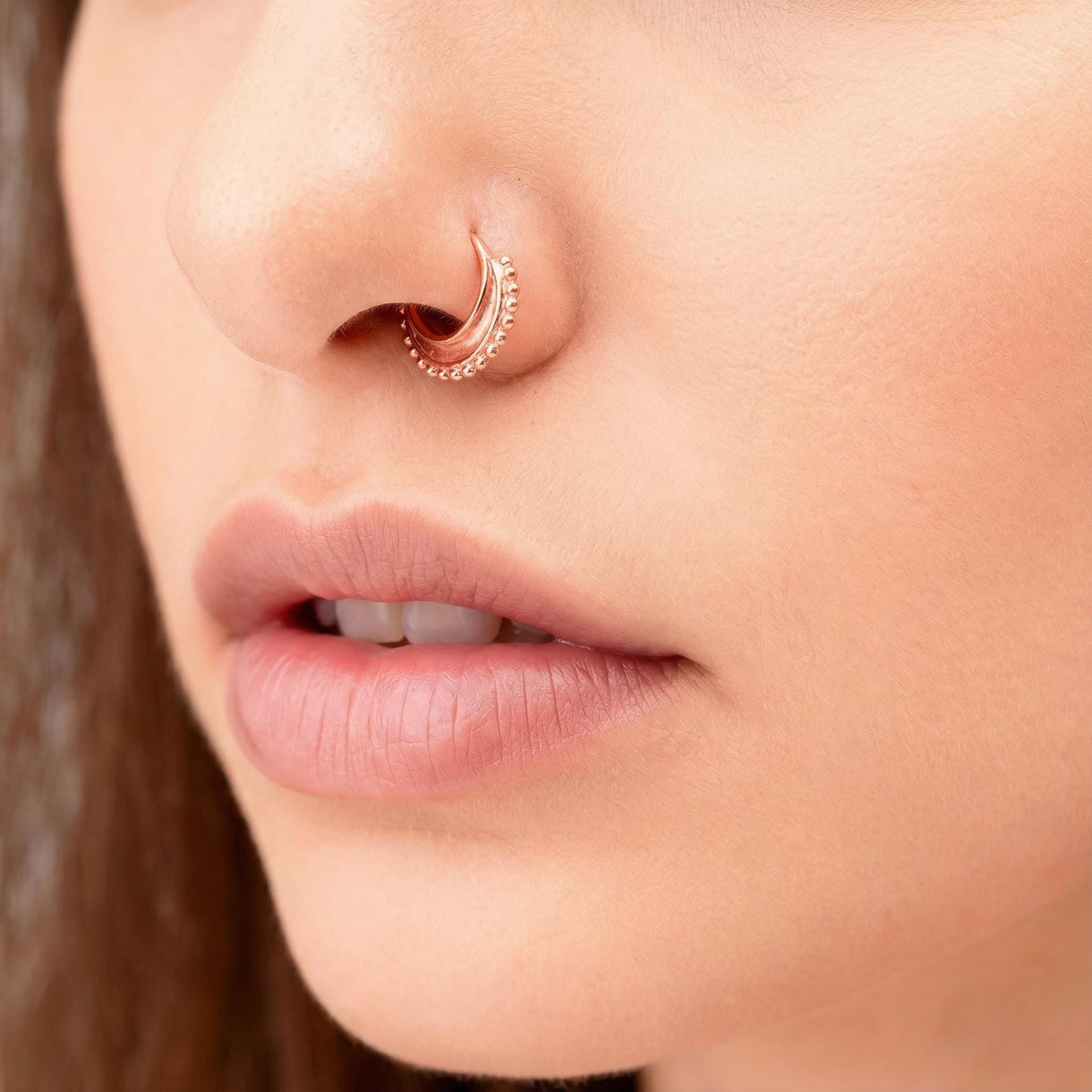 A close-up of a person's face, focusing on their nose and lips.