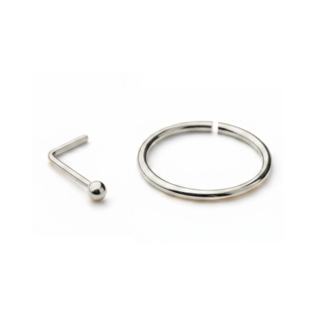a silver-colored nose ring and a silver-colored nose stud against a white background.
