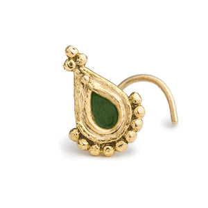A gold-colored nose ring with a green gemstone in the center.