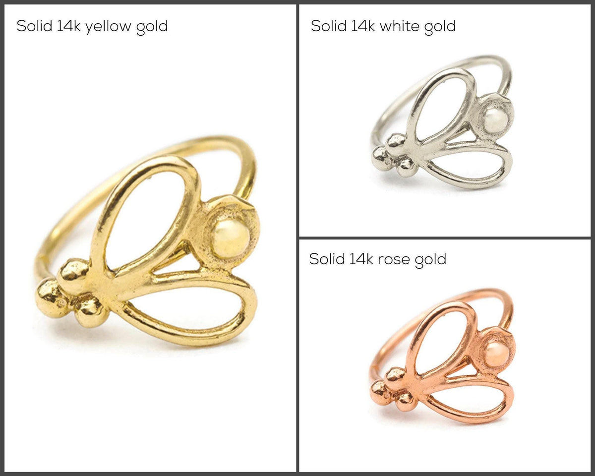 three different types of rings made of 14k gold, 14k white gold, and 14k rose gold, each with a unique design.