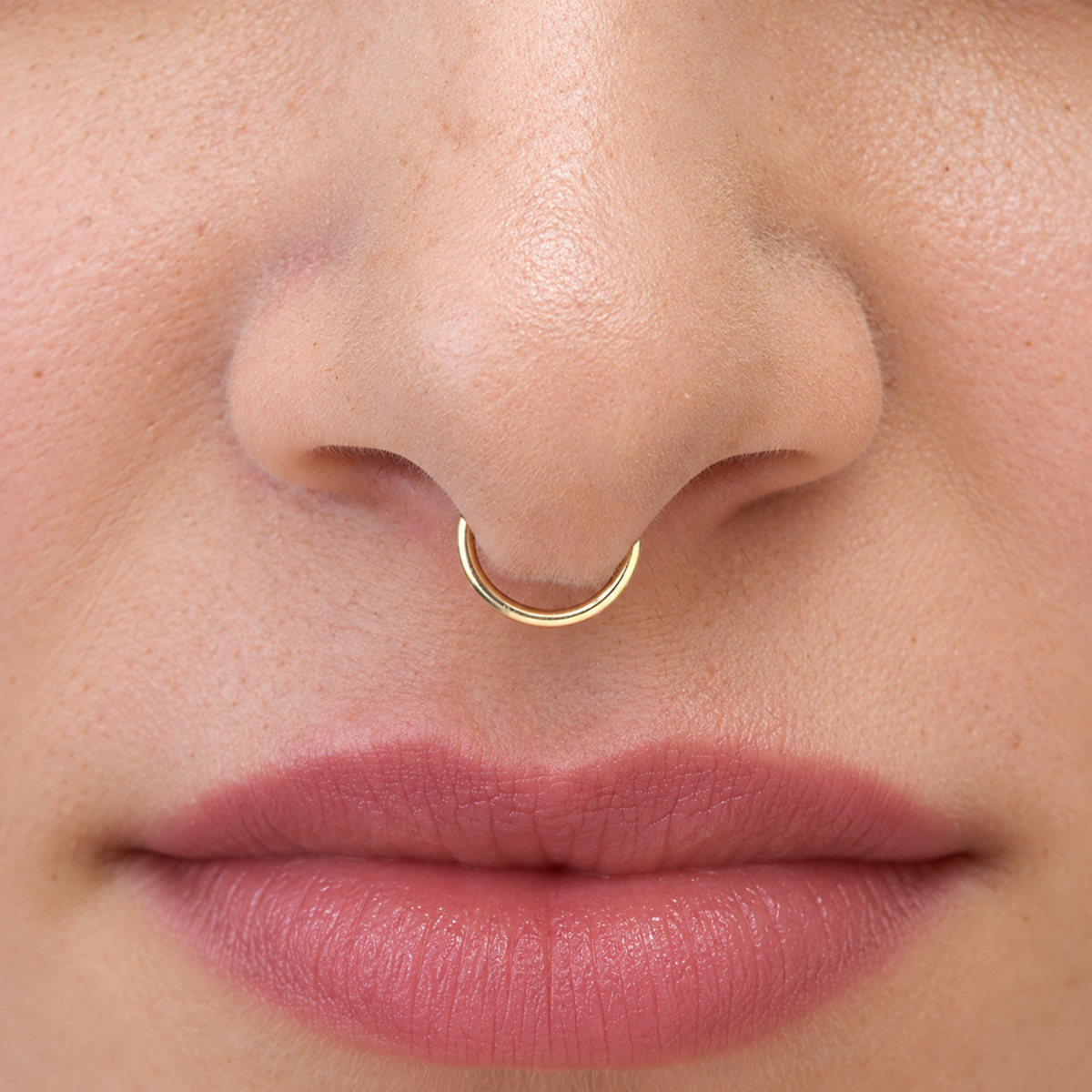 A close-up of a person's face, focusing on their nose and lips.