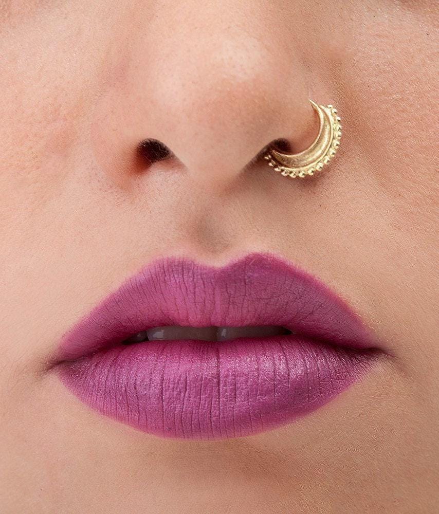 A close-up of a person's face, focusing on their lips and nose.