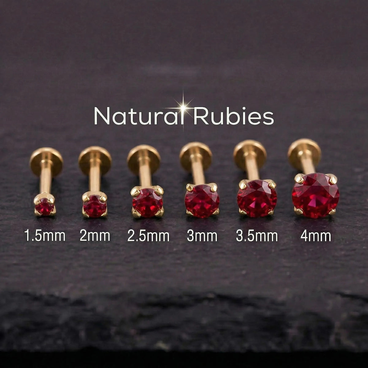 A collection of gold-colored metal piercings with red gemstones, ranging from 1.5mm to 4mm in size, arranged in a row.