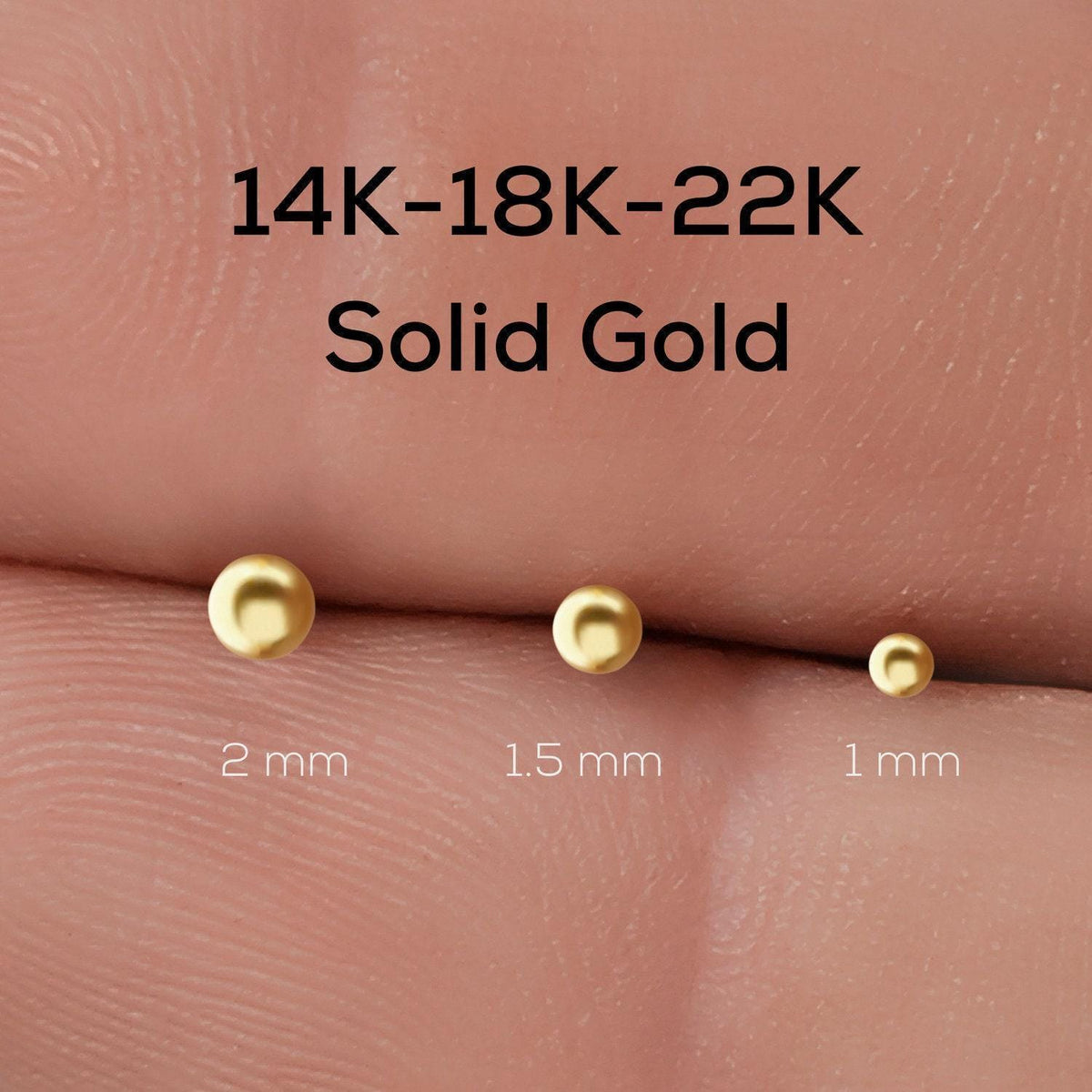 Ball Nose Stud: three gold-colored stud earrings of different sizes, ranging from 2 mm to 1 mm, with the largest one being 22 karat gold.