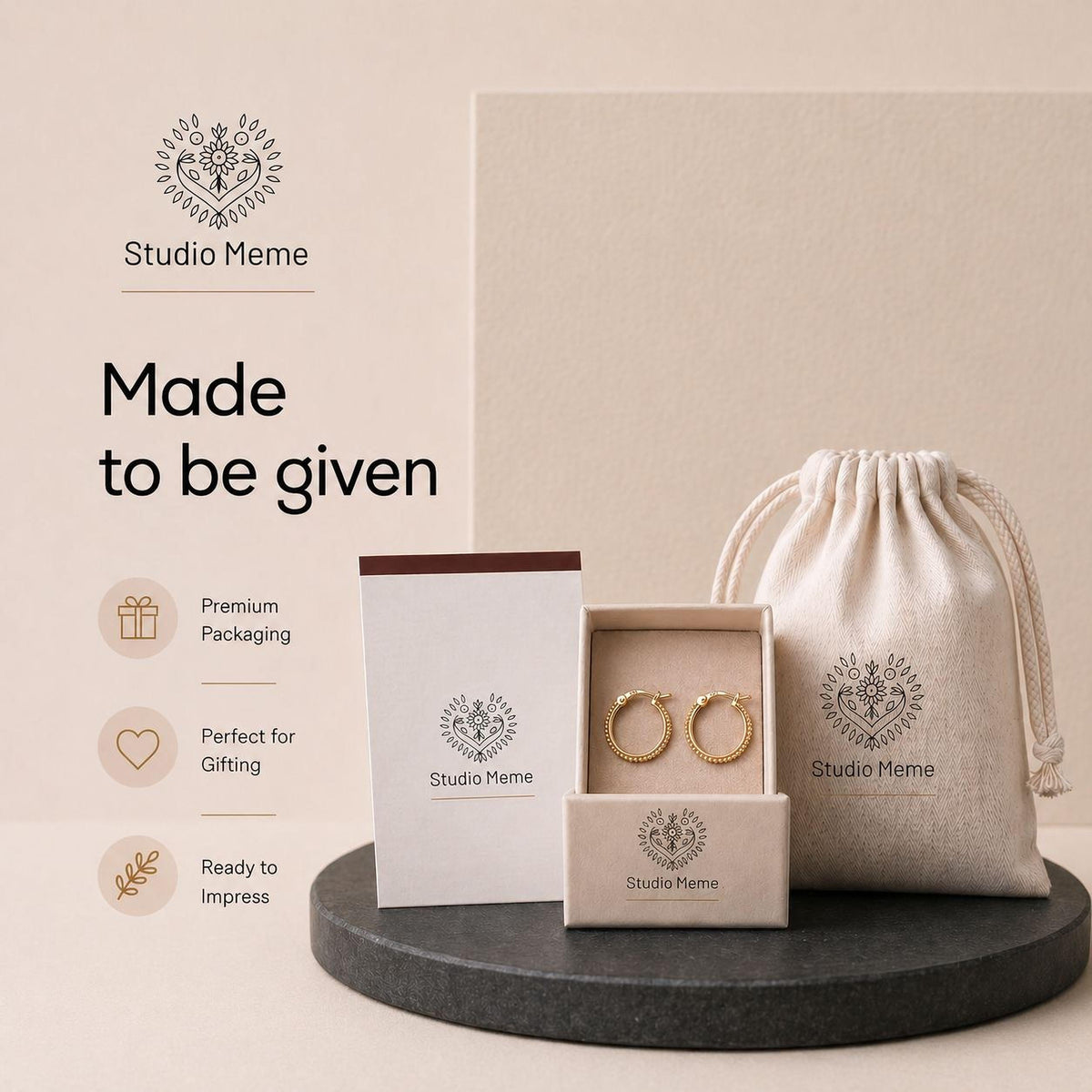 a set of jewelry packaging and a drawstring bag, all branded with the Studio Meme logo.