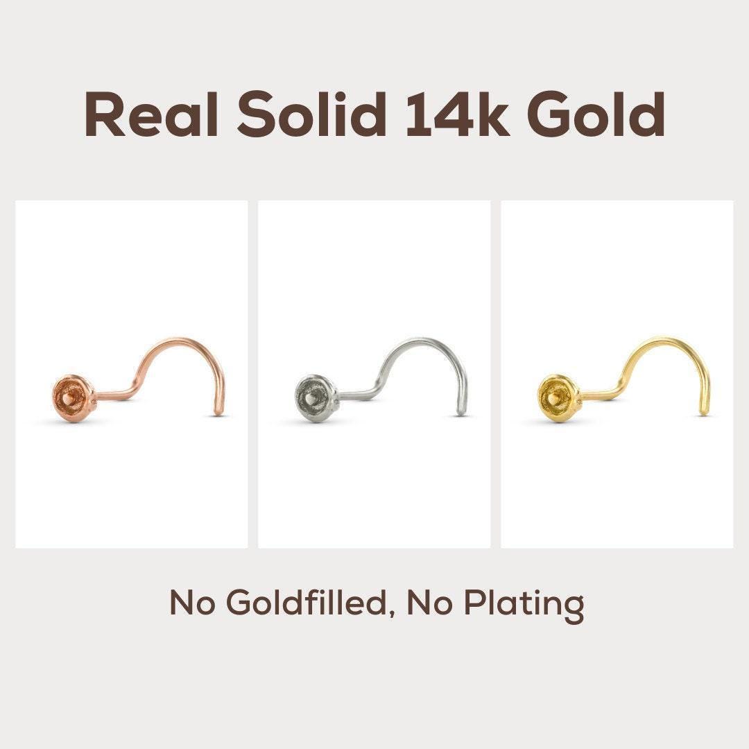 three different types of nose studs made of 14k gold, with no goldfilling or plating visible.