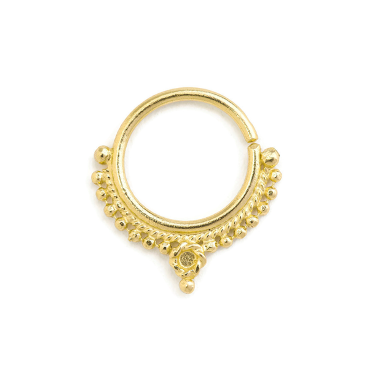 A gold-colored metal ring with a decorative floral design and small balls or stones adorning the surface.