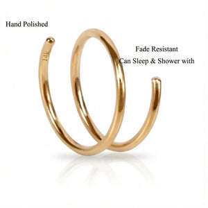 a gold-colored spiral ring with a hand-polished finish. The ring has a fade-resistant design, allowing it to sleep and shower without any issues.