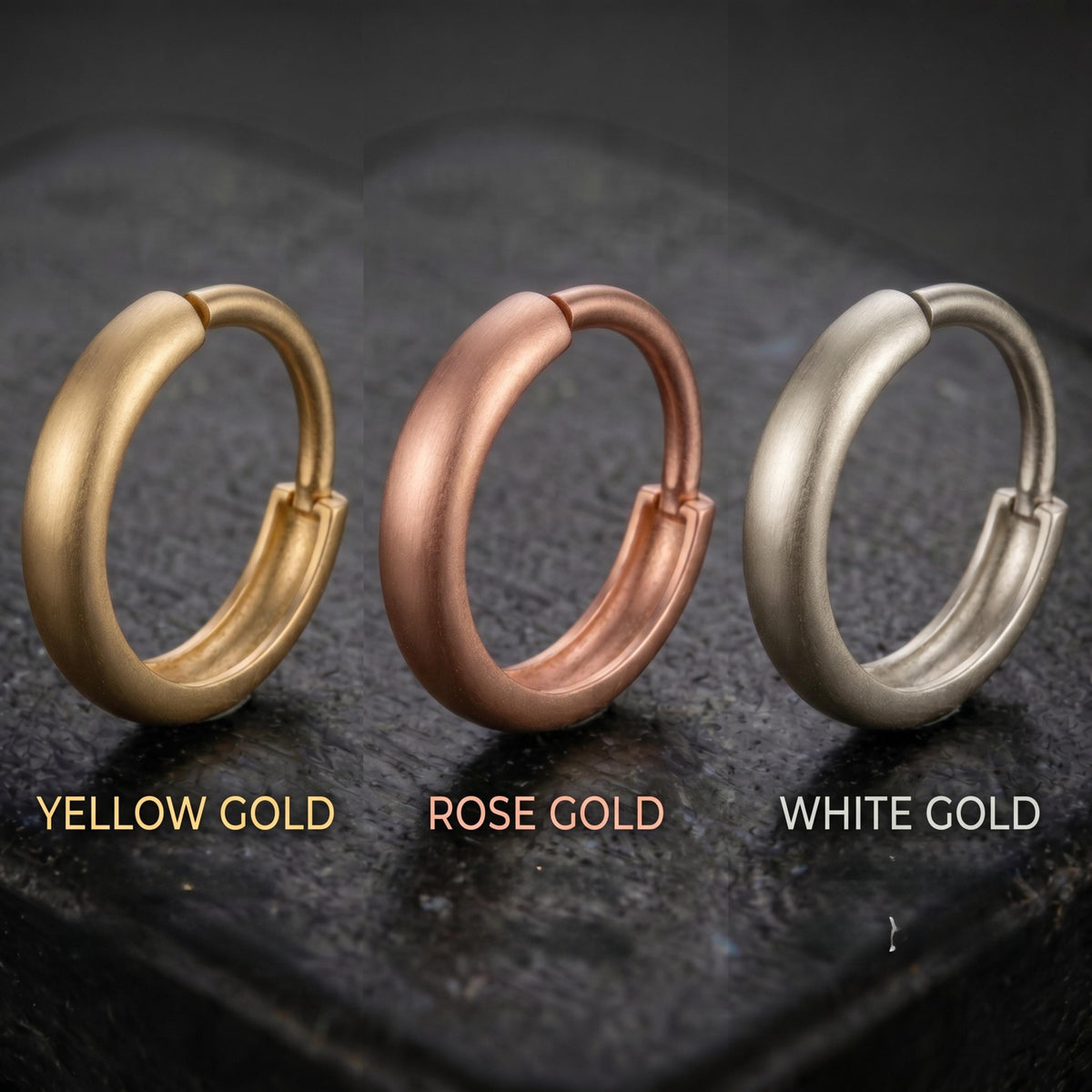 Three different colored earrings are displayed on a dark surface, each with a distinct color and design.