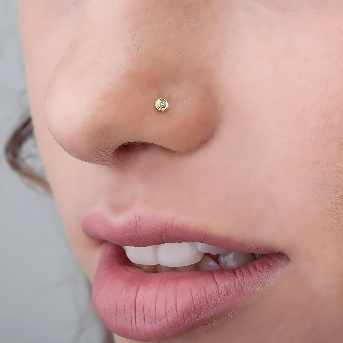 A close-up of a person's face, focusing on their nose and mouth area.