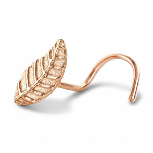 A gold-colored leaf-shaped nose ring is shown against a white background.