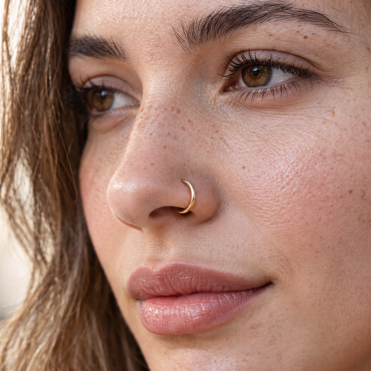 A close-up of a woman's face, focusing on her nose and lips.