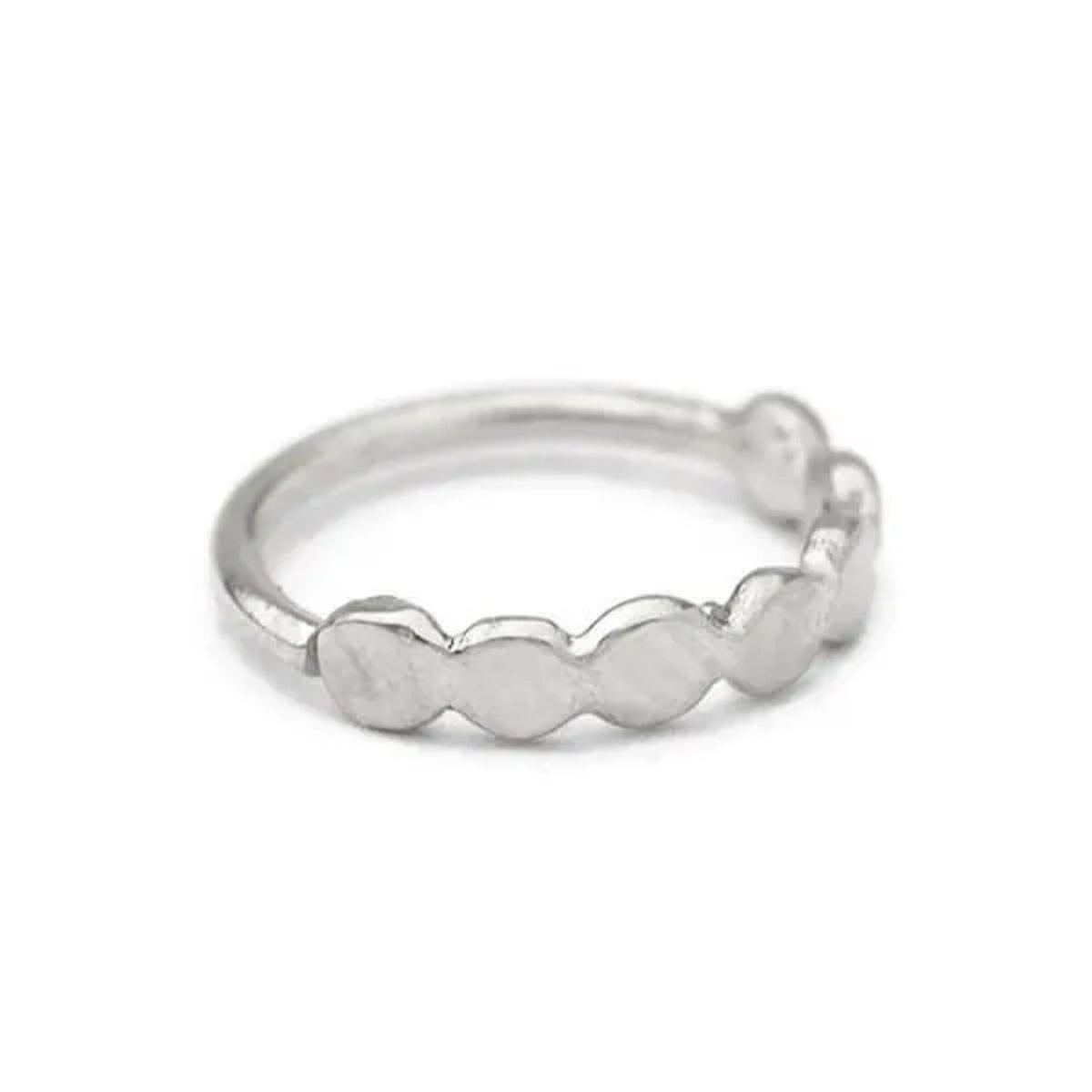 A silver ring with a row of small, round, metallic discs or circles arranged in a circular pattern.