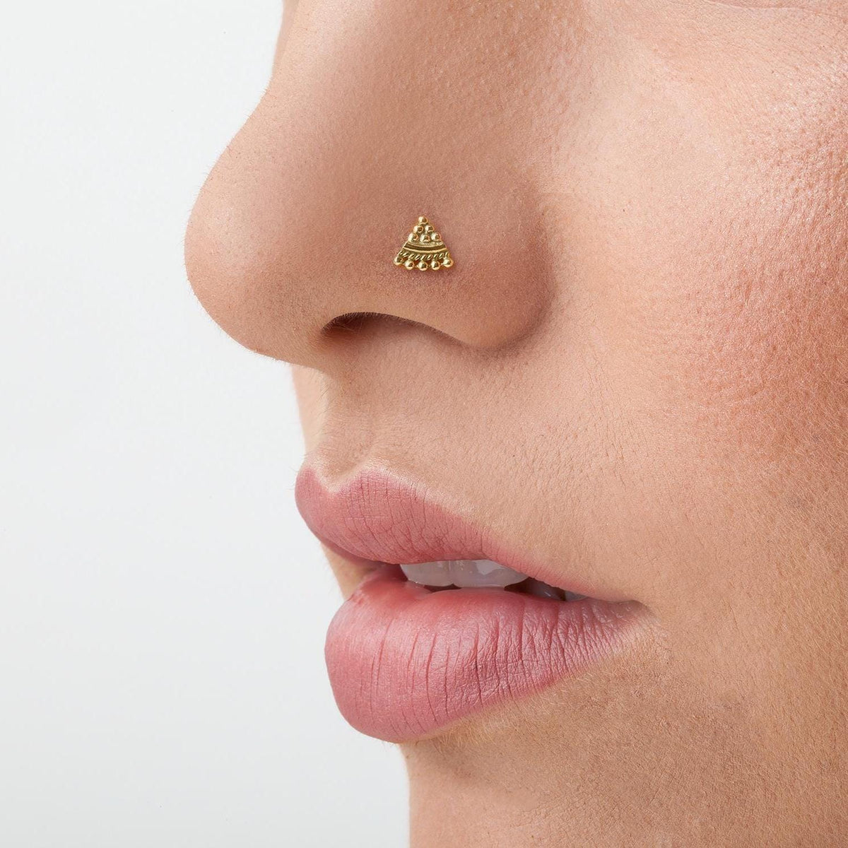 A close-up of a person's face, focusing on their nose and lips.