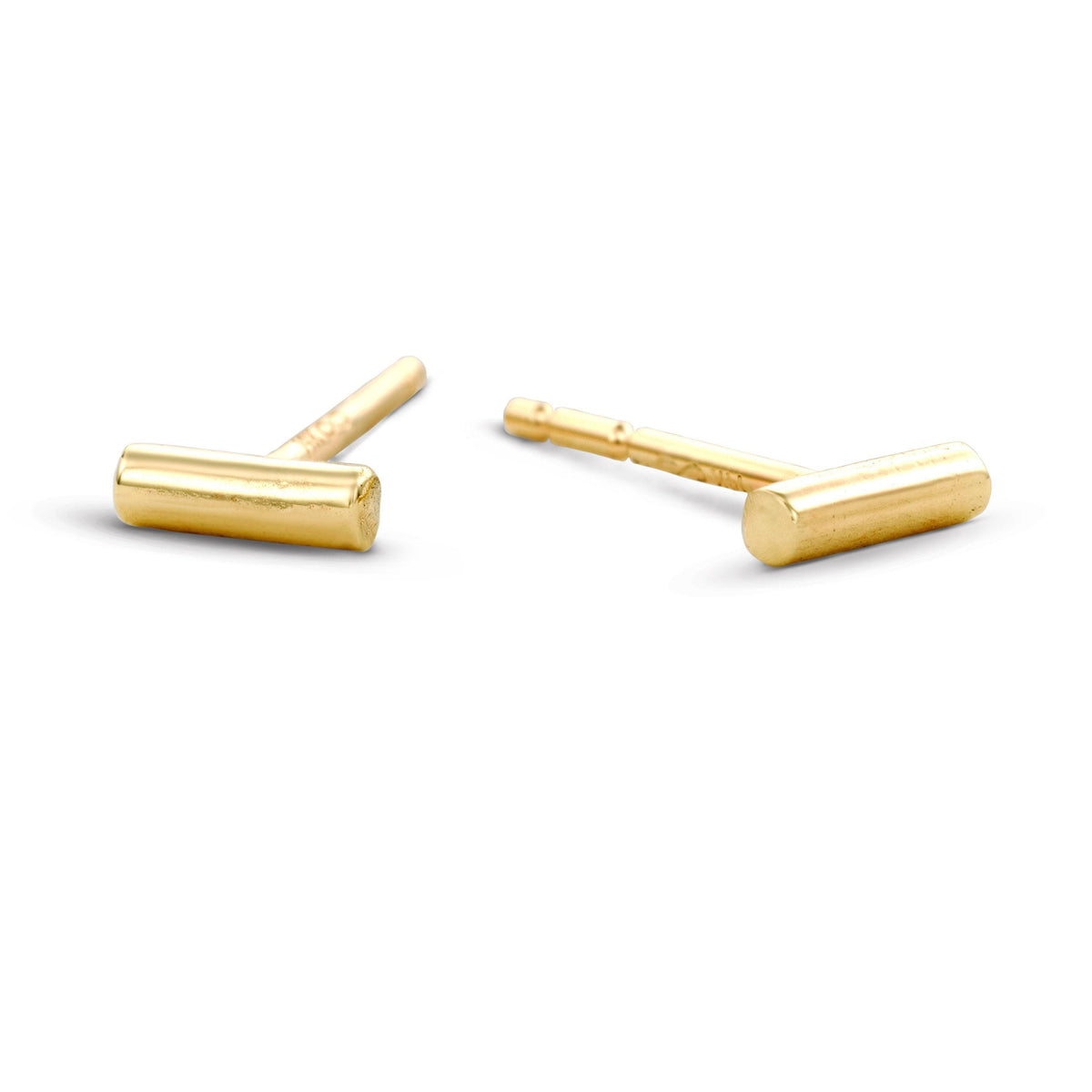 a pair of gold-colored earrings with a simple, elegant design.