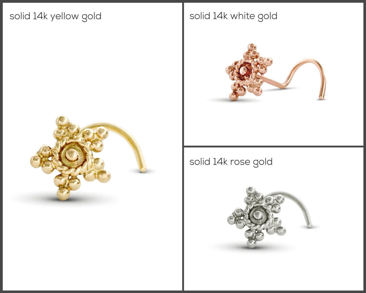 four different types of nose piercings, each with a distinct color and material. The first piercing is solid 14k yellow gold, the second is solid 14k white gold, the third is solid 14k rose gold, and the fourth is solid silver.