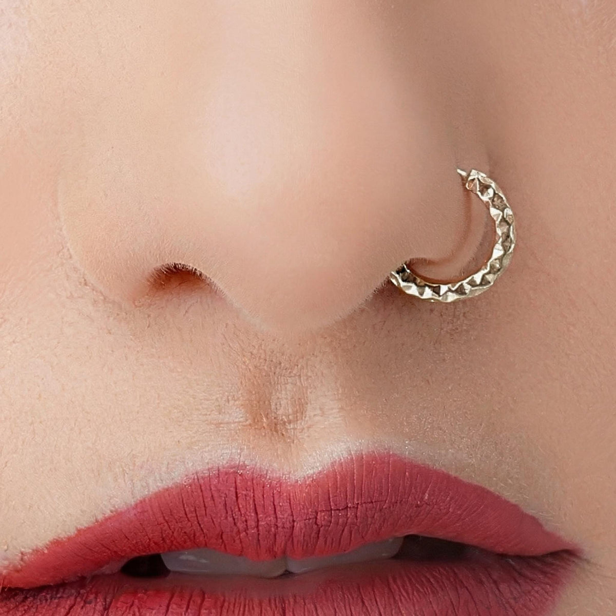 A close-up of a person's face, focusing on their lips and nose.